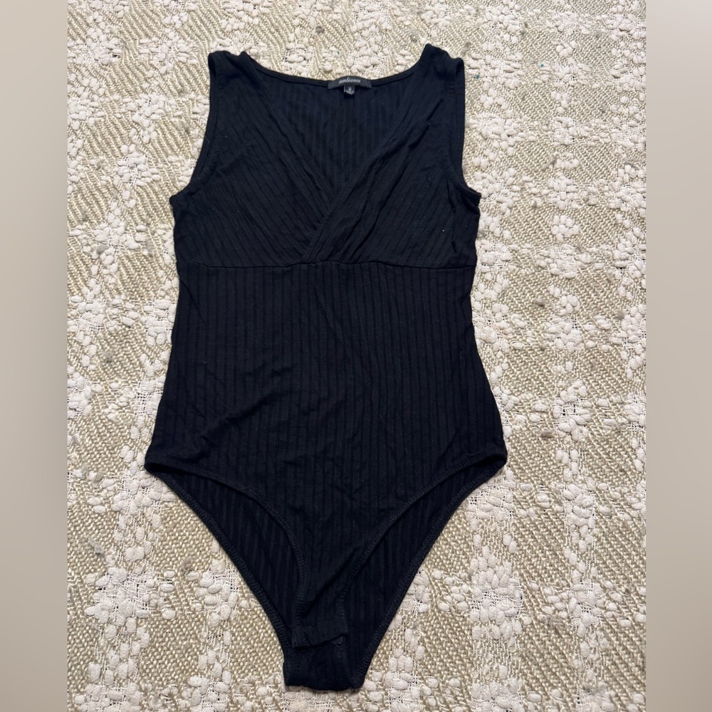 Sexy black sleeveless V-neck Ambiance bodysuit, size M.